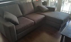 Beautiful urban barn charcoal grey sectional in excellent condition. Reversable chaise. 8 ft long x 5ft chaise