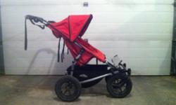 The narrowist side by side double buggy on the market.  Fits easily through shop doors.  Front wheels lock up for rougher terrain.  Comes with a rain cover.