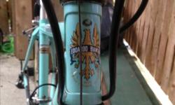 Beautiful two-toned (turquoise/lilac) bicycle. Vintage with very little damage: some scrapes in the paint, and the rear view mirror is cracked. Damage is purely cosmetic, all her mechanisms are in prime working order. She is a smooth, luxurious ride,