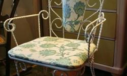 Newly upholstered vintage wrought iron chair at The Junction! Very substantial with a solid frame and lovely curling twists of cast iron that have been whitewashed long ago. Brand new fabric is in perfect condition-- an excellent accent chair or extra
