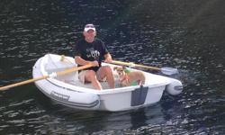 - 10' rigid/inflatable with beautiful wood oars
- motors beautifully with outboard, rows like butter with oars
- includes inflatable tubing around perimetre of boat, which makes it virtually untippable
- stored on land
- only very lightly used