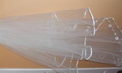 I am selling my wedding gown and veil, white, size 10, worn once for photos, very simple and elegant, strapless, with gloves, A line.  Picture doesn't do it justice, it is a lot nicer in reality.