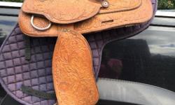 Beautiful textan Hereford western saddle for sale .. 16 " seat in great condition . 550.00 obo