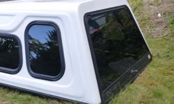 White (Hornby's) canopy. 74 ish inches by 60 inches. This is a Hi-Rise style with sliding windows and screens. This came from a Mazda B2600 (will also fit Ford Rangers.) You can call or email. 250 619-1295