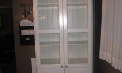 1 year old Ikea Liatorp -White 6 shelf -bookshelf with glass doors..still sold at Ikea..Bookshelf sells for 349. and glass doors are 180. for the pair..used as cabinet in dining room..Excellent condition. 13.5" depth x 35" width x 7 ft height. Very nice