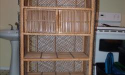 wicker shelf with 5 shelves, one with doors
60.25 inches tall by 14 inches deep and 29.5 inches wide