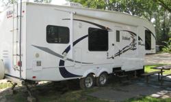 2009 WILDCAT 28RKBS FOR SALE-NEW CONDITION-REAR KITCHEN, 2 SLIDE-OUTS, TWO COUCHES, ELECTRIC AWNING, HYDRAULIC LEVELING JACKS, POWER REAR JACKS, BACK HITCH FOR EXTRA TOWING, ENCLOSED UNDERBELLY,SLEEPS 6, OUTSIDE SHOWER,LADDER, SPARE TIRE, HIDDEN GARBAGE,