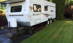 his 22' Wilderness Travel Trailer is like new. It includes ducted air conditioning, furnace with in-floor ducted heat, solar heat panel, 40 gallon fresh water tank, 6 gallon propane fired hot water heater, Entertainment Center includes pre-wired stereo,