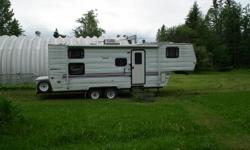 5th wheel with electric jacks and and full slide. Sleeps 8, with bunks. Full bathroom. New upholstery, new hot water tank, new batteries. Clean, well maintained. Stored in doors all winters.