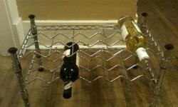 Double layer metal wine rack. Holds 10 bottles of wine. Has rubber stops on the legs so it wont scratch the surface it sits on.
L21" x H12" x W12"