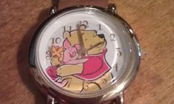 This watch is about 15 years old (bought it when my oldest was tiny..she is 16.5 now!)
 
It was only ever worn ONCE, for fear of something happening to it!!
 
It works, but does need a battery.
 
Genuine leather strap, stamped on back bezel with Disney