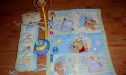 Adorable Winnie the Pooh Bedding and Mobile,
Comes with Blanket, sheet, bumperpads and a Mobile with a remote and little nightlight.
The mobile plays classical songs, winnie the pooh theme song, and Nature Sounds, the bubble on the front changes colors