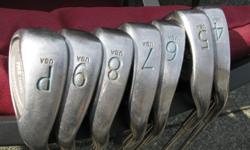 Womans Powerbuilt clubs 4 to PW and 1, 3, 5 woods (metal), good shape. Putter included. see photos