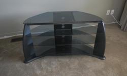 Black wood & smoked glass entertainment stand.
42" wide X 17.5" deep X 25" high. Top shelf tapered down to 18" at back. Great for a corner in the room. Three shelves below. Lots of room for components.
During the day call 250-889-8323 or 250-595-4141