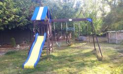 $100 OBO
Wooden Swing Set with fort, picnic table, slide and monkey bar.