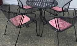 28" wrought iron table with 4 chairs and cushions.
Very good condition.