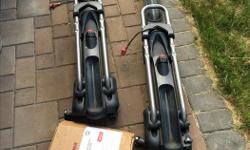 Two Yakima Highroller bike racks with universal mounting kits in excellent condition.