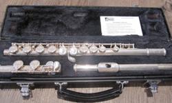 Can you believe it...a high school student who doesn't want to play flute anymore????? :)
We purchased this lovely instrument 3 years ago for approx.. $800 from St. John's Music. They have 'tuned-it-up' each year since.
It sounds more beautiful being