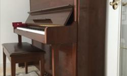 (First owner) 1988, serial #4492xxx, Yamaha U1E upright piano, made in Japan, with bench that opens for books storage. Excellent condition. Serious purchasers only.