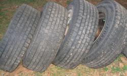 215/70R15 & rims fit ford or dodge 5 hole, tires have 9/32 of tread left.