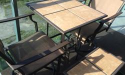 Counter-height bistro set. Purchased at Sears 7 years ago. Mesh on swivel chairs is in excellent shape. Ceramic tiles on table top like new (no chips or cracks). Some rust on metal. Also includes a small matching side table.
The gravity recliners are