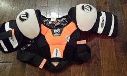 Never used Winnwell shoulder pads for child size large.