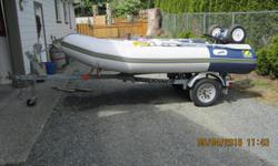 11 ft Zodiac Boat with 20 hp Yamaha motor on Road runner trailer. Includes Portage wheels, airpump, gas tank, oars.
50 hours on motor and boat - like new condition.
all reasonable offers considered
