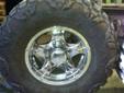 305-70-r-16 NITTO MUD GRAPPLERS ON 8 HOLE CORE RACING RIMS