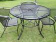 Black Wrought Iron Patio Table with Three Chairs