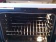 White and black whirlpool flat top stove/oven